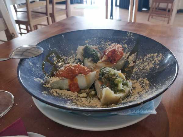 Gofio sprinkled over cod and mojos in Bodegón San Vicente, Tenerife.